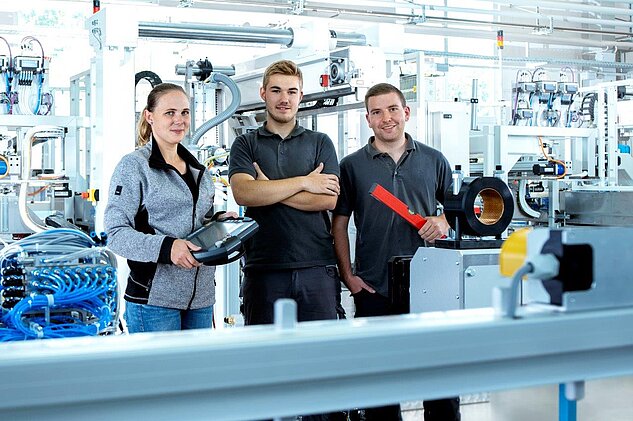 group photo of three apprentices in Engen