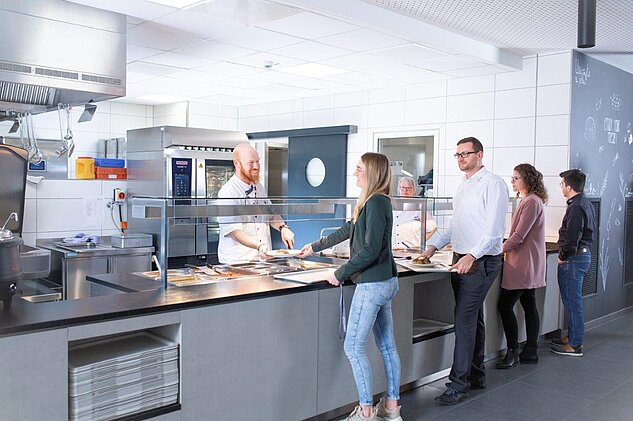 employees-having-lunch-in-canteen