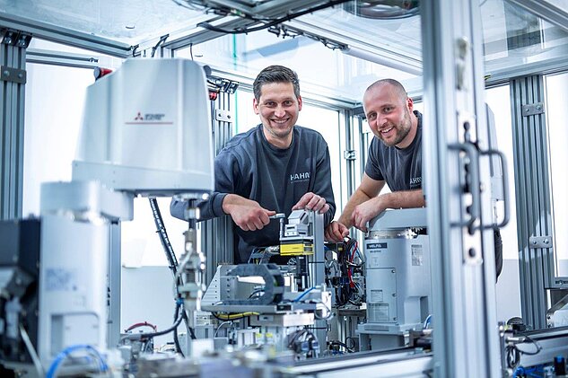 Two Assembly Technicians working together on a production line