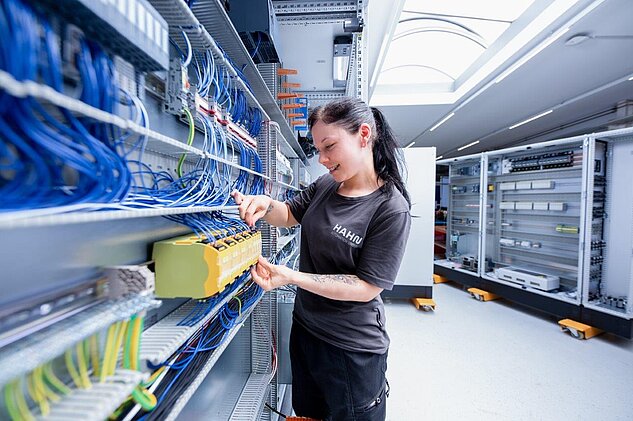 Electronics Technician working in Controls Cabinet Assembly