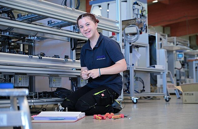 female apprentice working in assembly